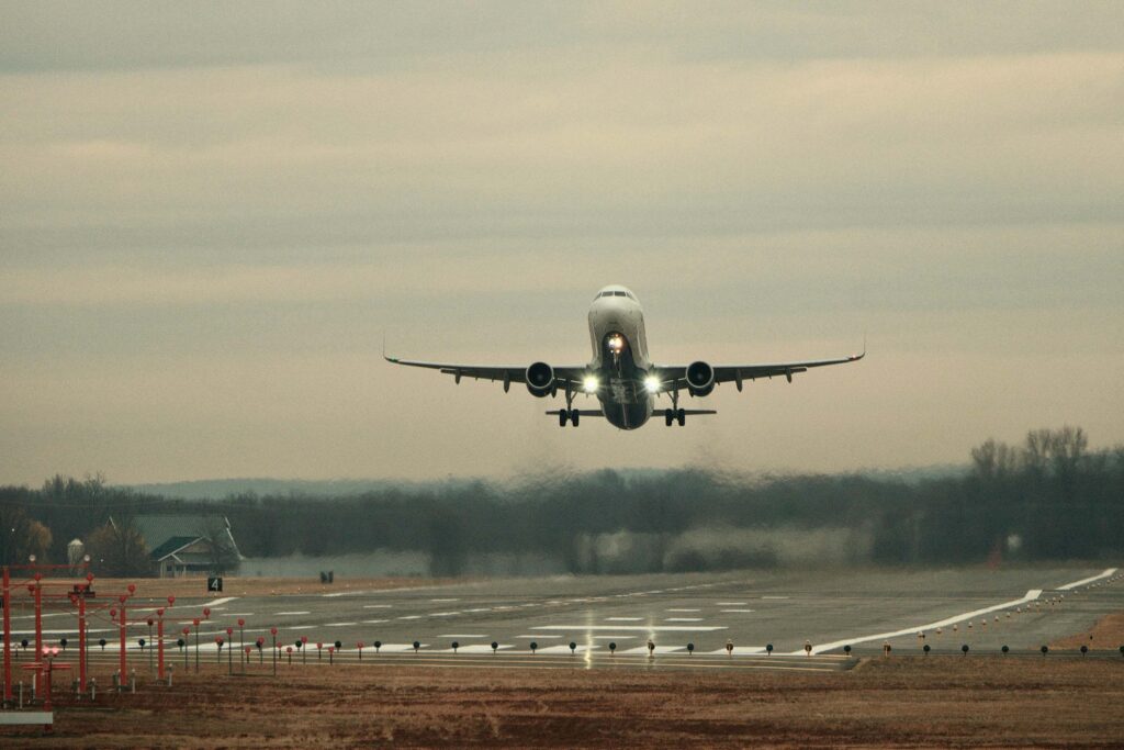 airplane taking off. Engines cause wings to move through air and generate lift